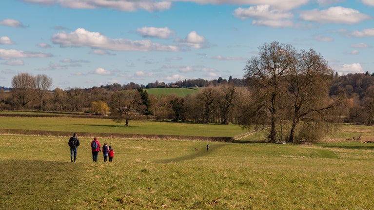 People walking across the parkland at Mottisfont, Hampshire